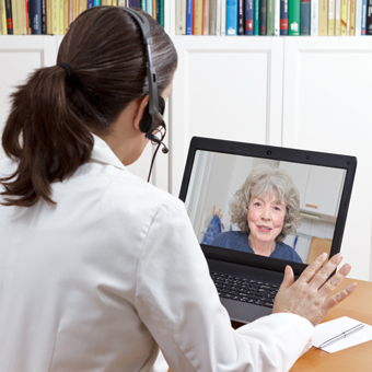 a woman talks to an older woman via face call 