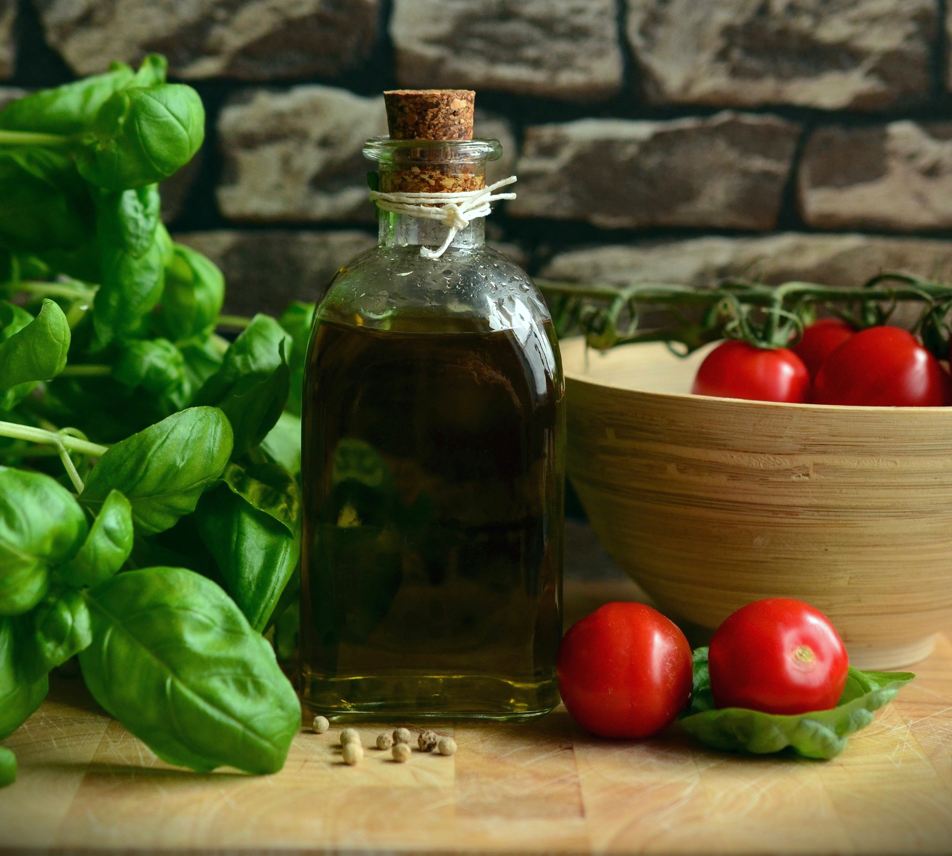 Picture of basil plant, vinegar and tomatoes